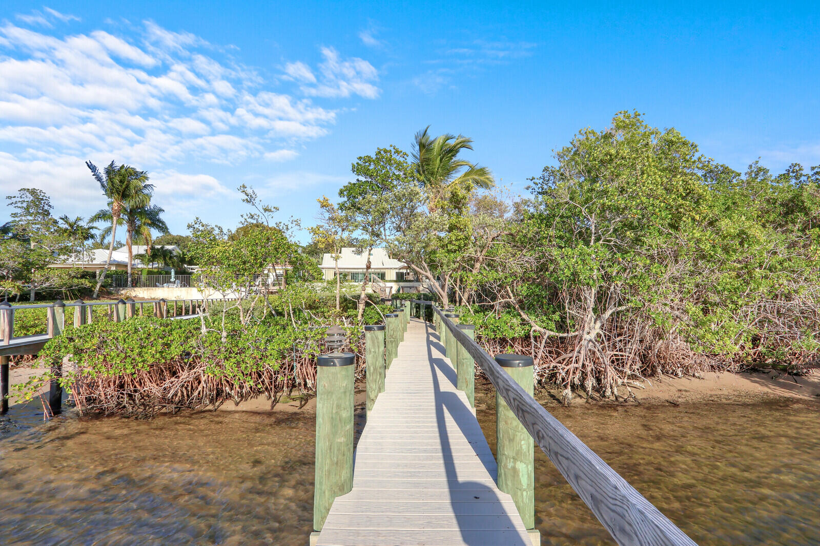 352 River Edge Road Jupiter, FL 33477 - Photo 10 of 50 a view of a lake with a building in the background