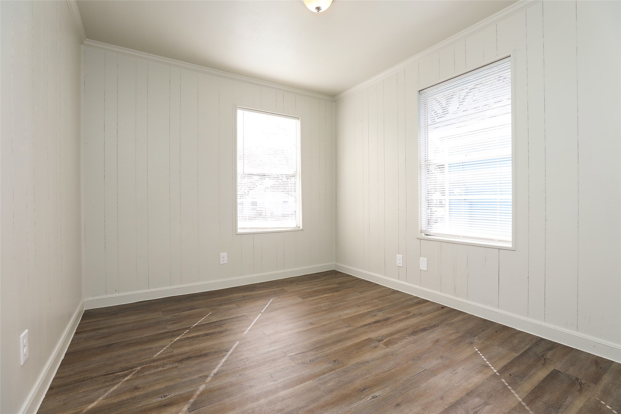 3606 Live Oak Street Houston, TX 77004 - Photo 8 of 15 an empty room with wooden floor and windows