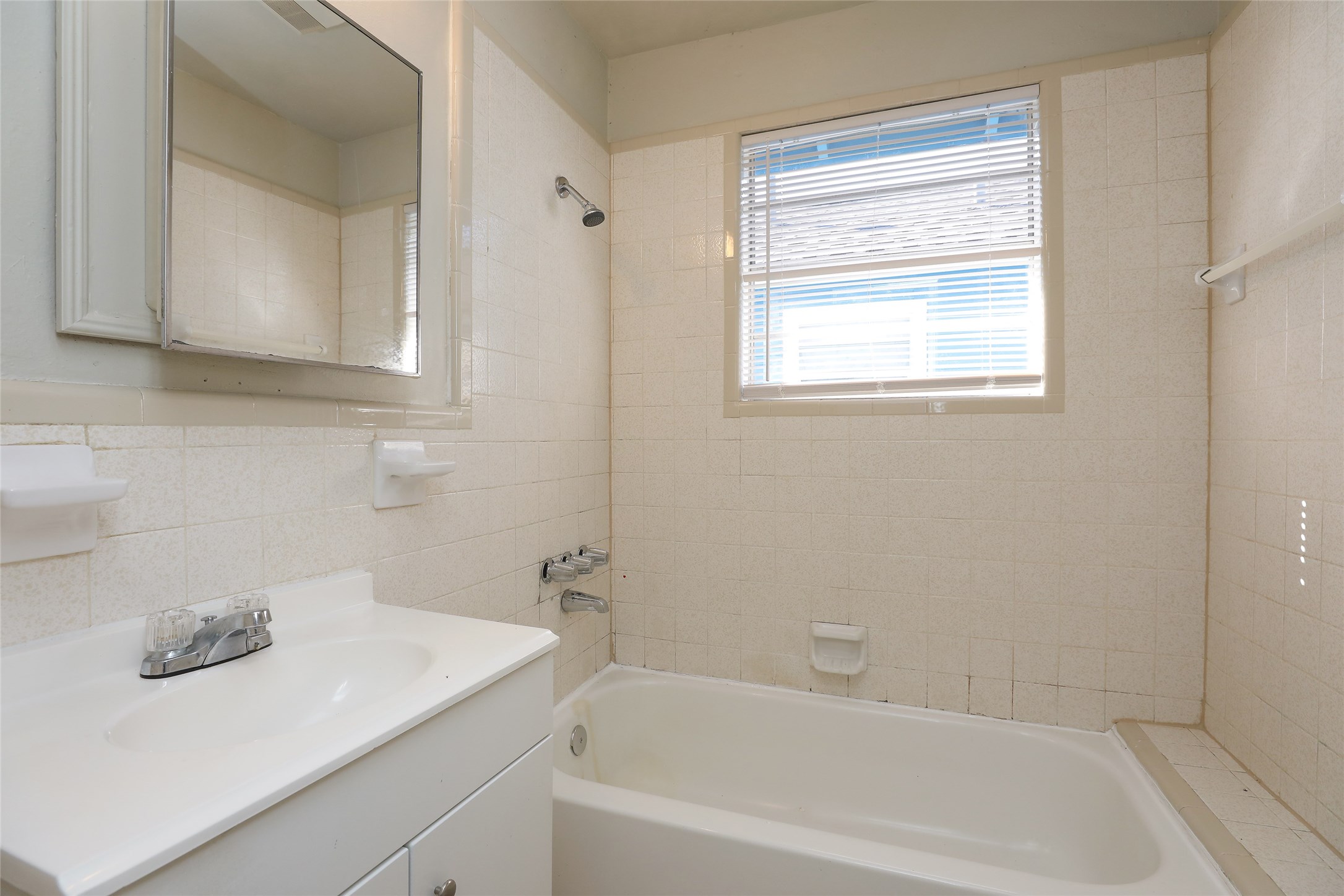 3606 Live Oak Street Houston, TX 77004 - Photo 9 of 15 a bathroom with a bathtub sink and mirror