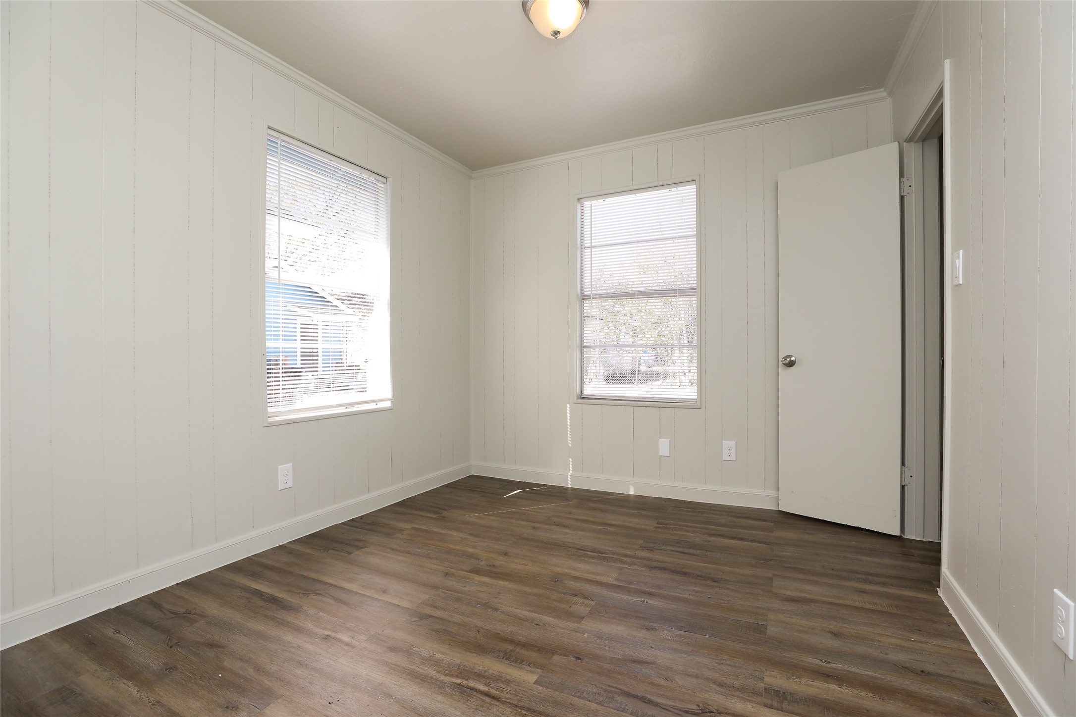 3606 Live Oak Street Houston, TX 77004 - Photo 10 of 15 an empty room with wooden floor and windows