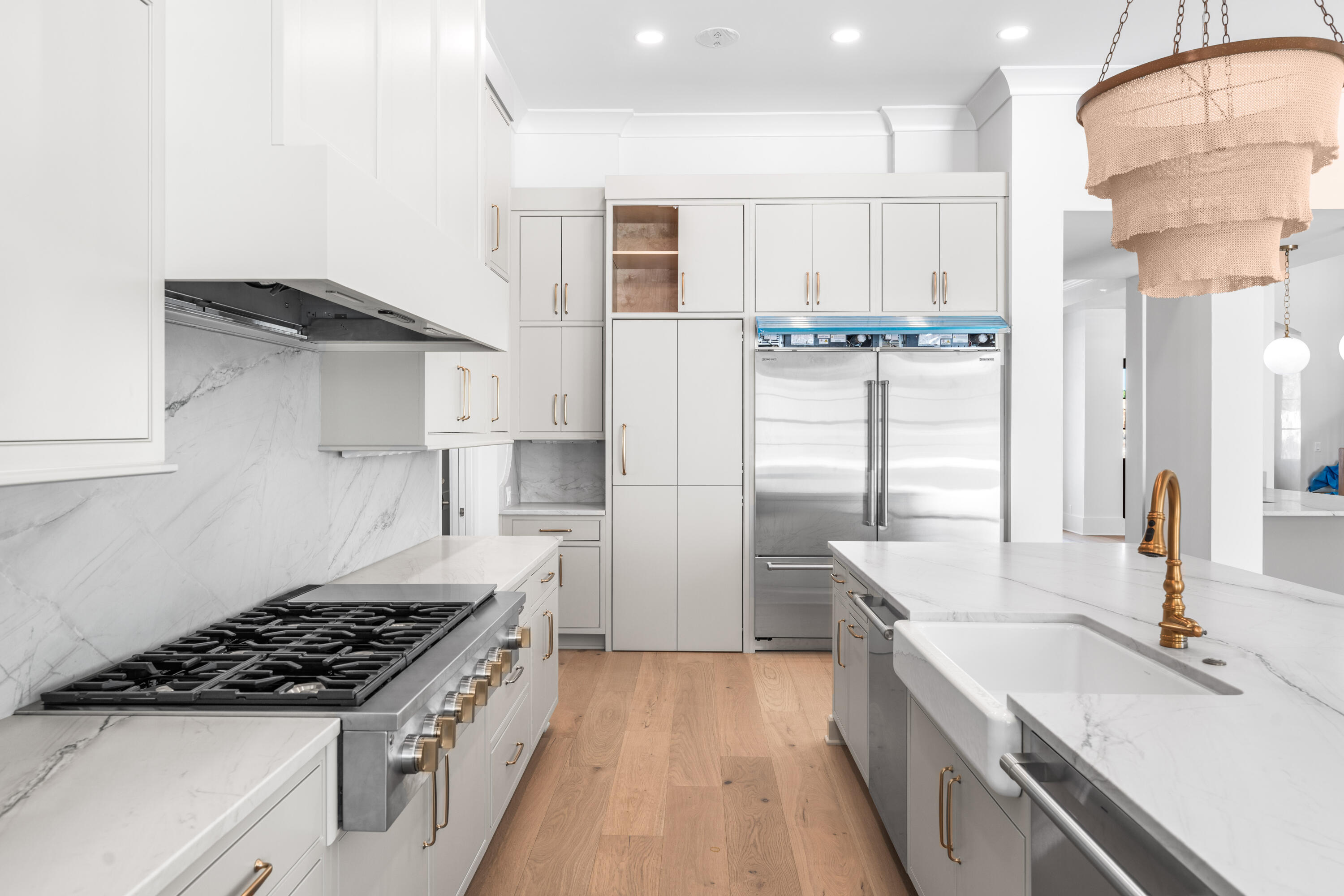 303 Golfridge Drive Watersound, FL 32461 - Photo 11 of 50 a kitchen with stainless steel appliances a sink stove and refrigerator