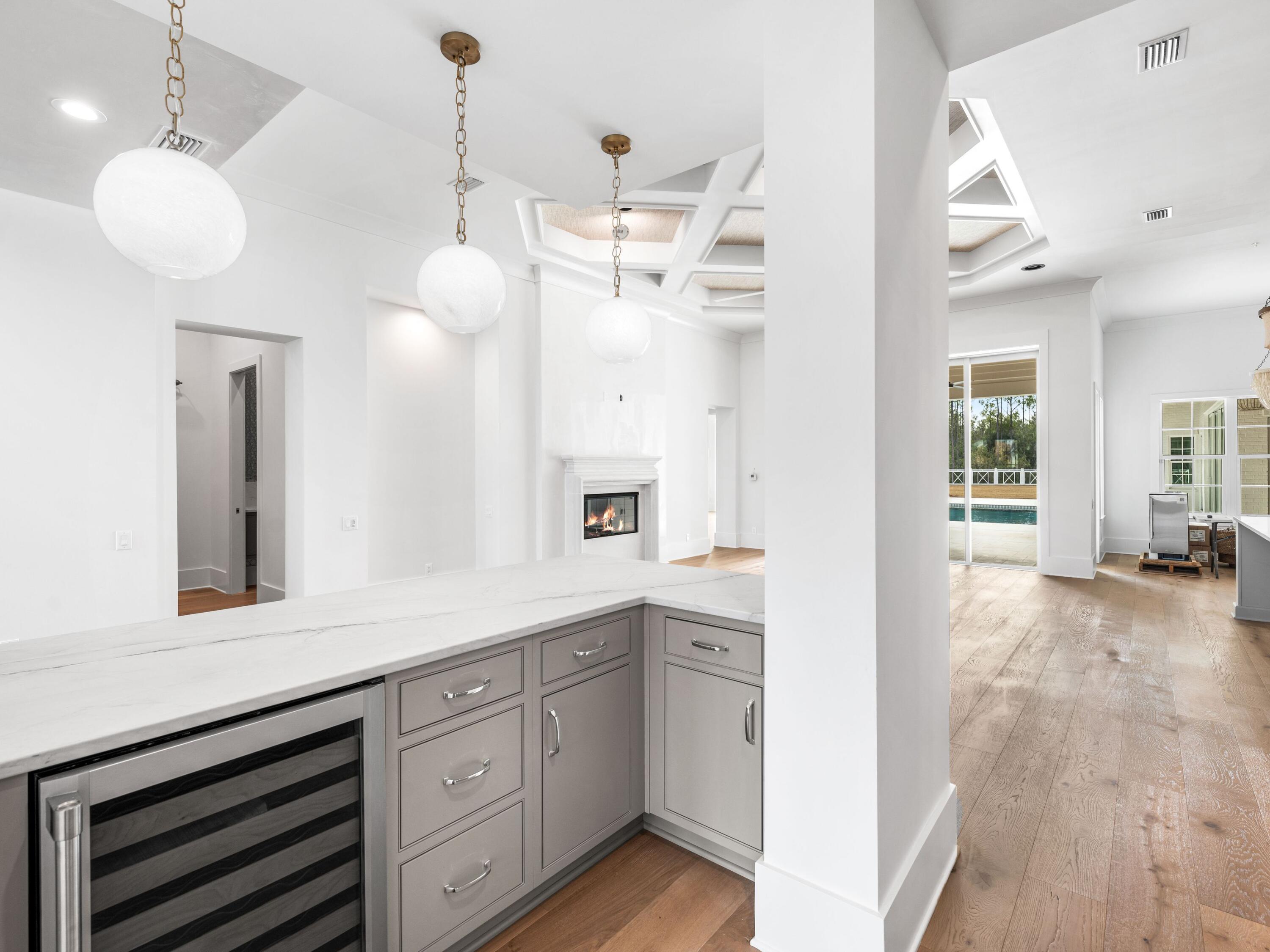 303 Golfridge Drive Watersound, FL 32461 - Photo 20 of 50 a view of a kitchen center island and stainless steel appliances