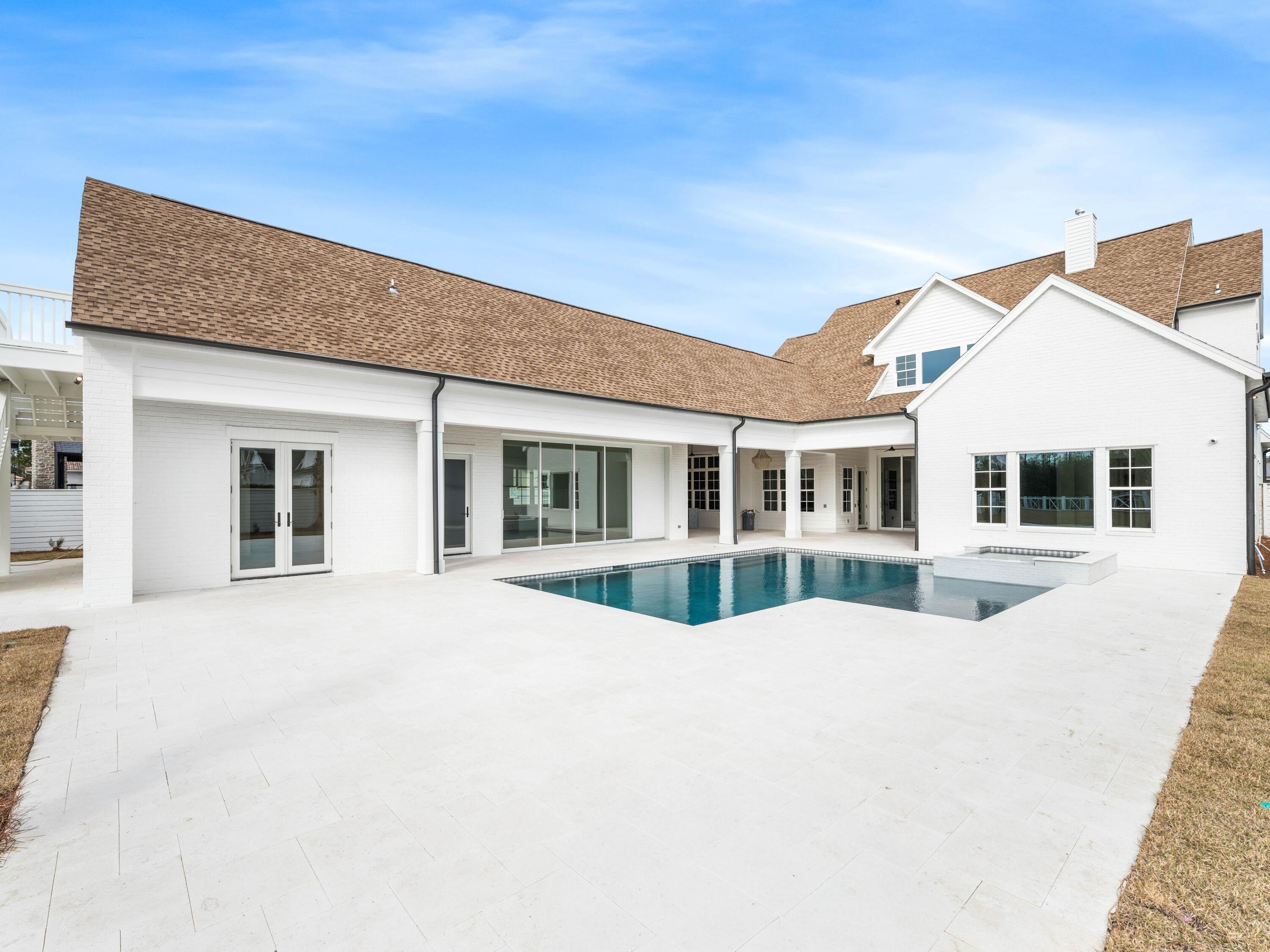 303 Golfridge Drive Watersound, FL 32461 - Photo 2 of 50 a front view of a house with a outdoor space