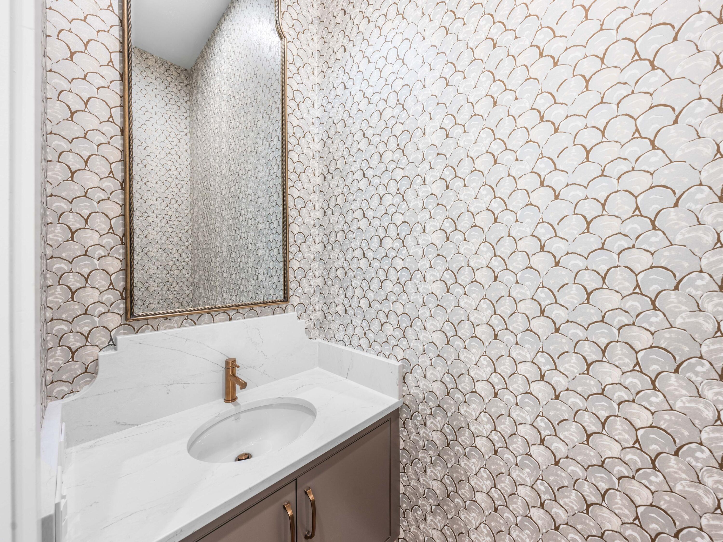 303 Golfridge Drive Watersound, FL 32461 - Photo 26 of 50 a bathroom with a sink and a mirror