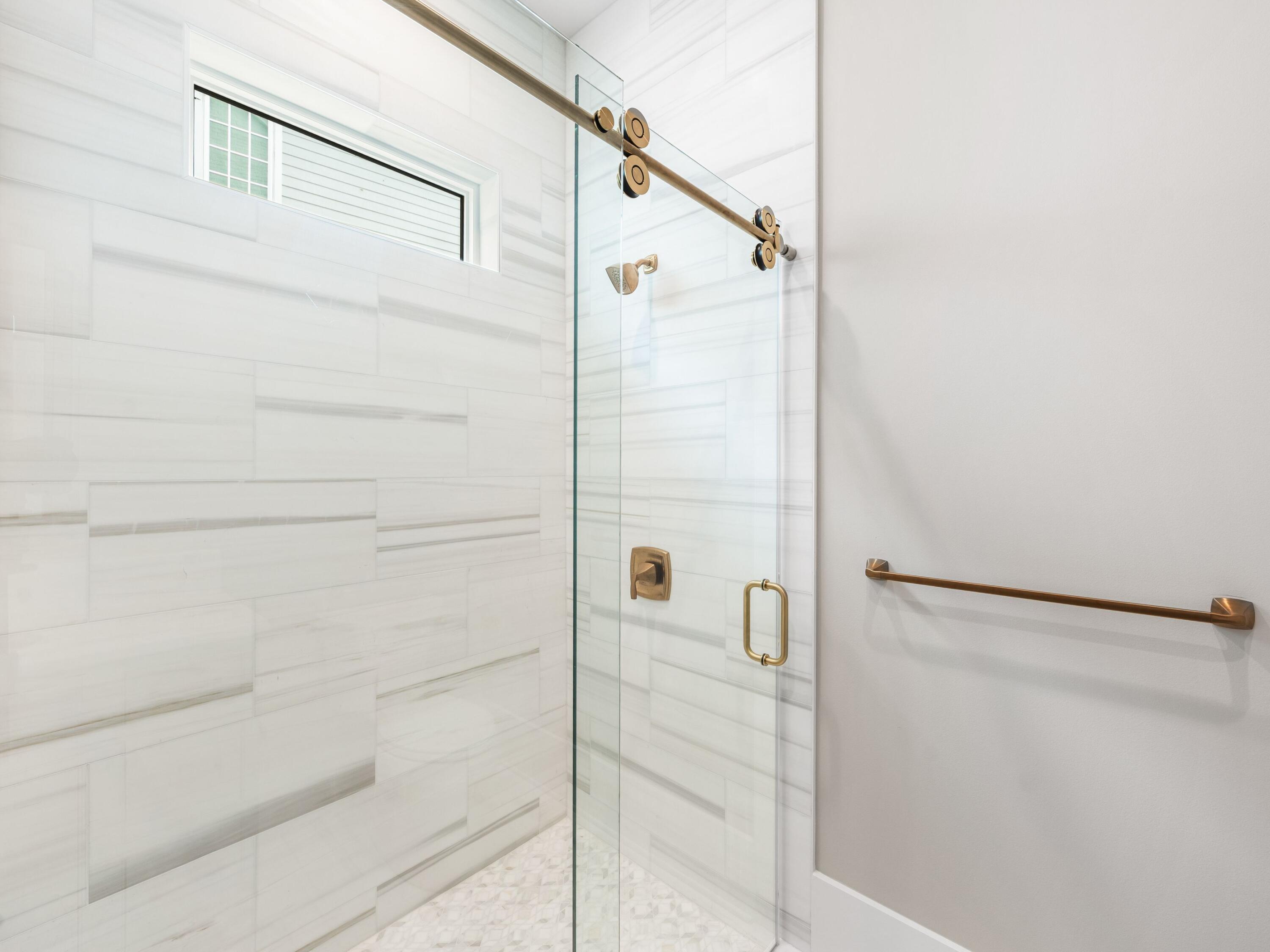 303 Golfridge Drive Watersound, FL 32461 - Photo 29 of 50 a bathroom with a shower