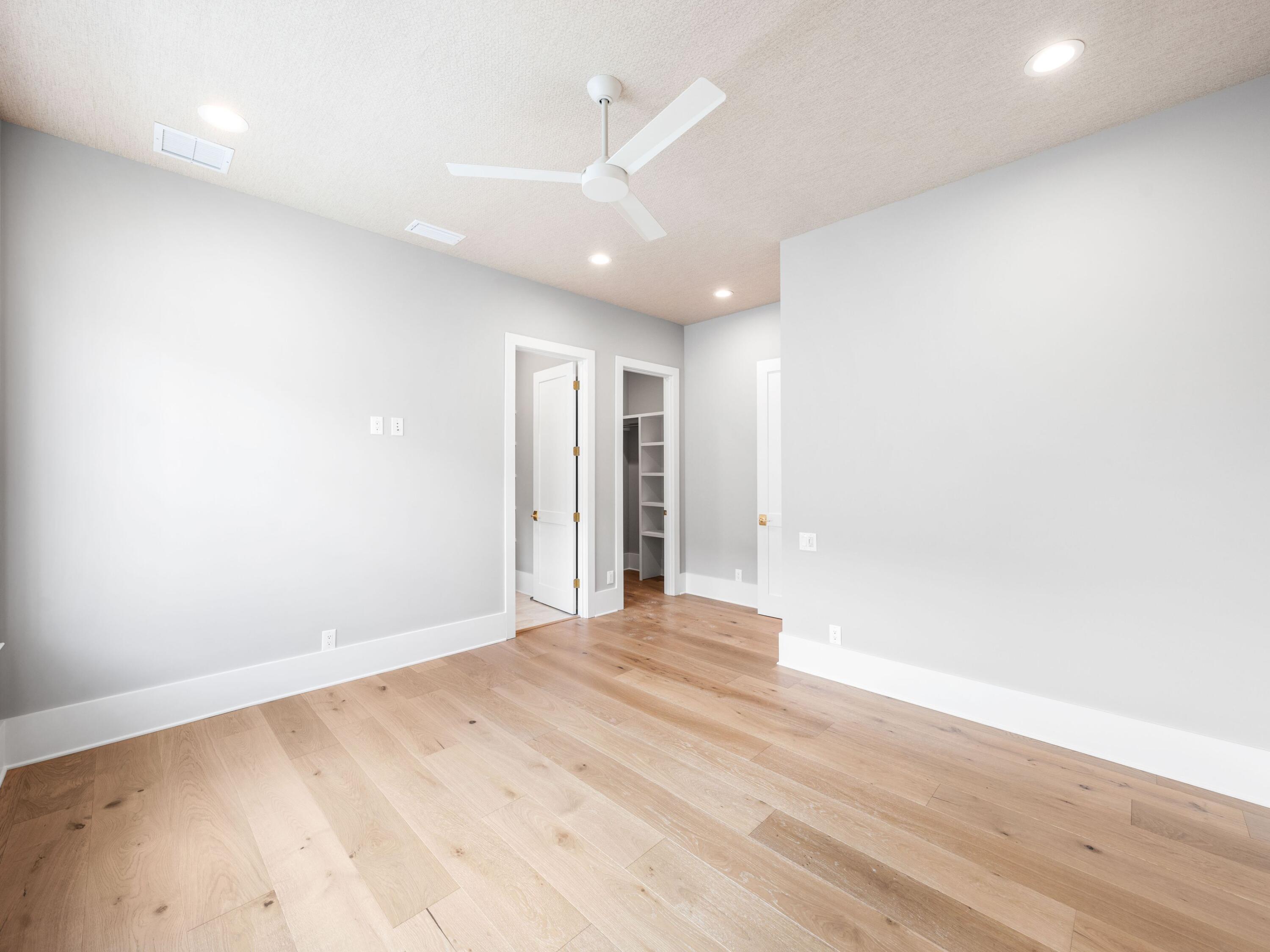 303 Golfridge Drive Watersound, FL 32461 - Photo 35 of 50 a view of an empty room with wooden floor