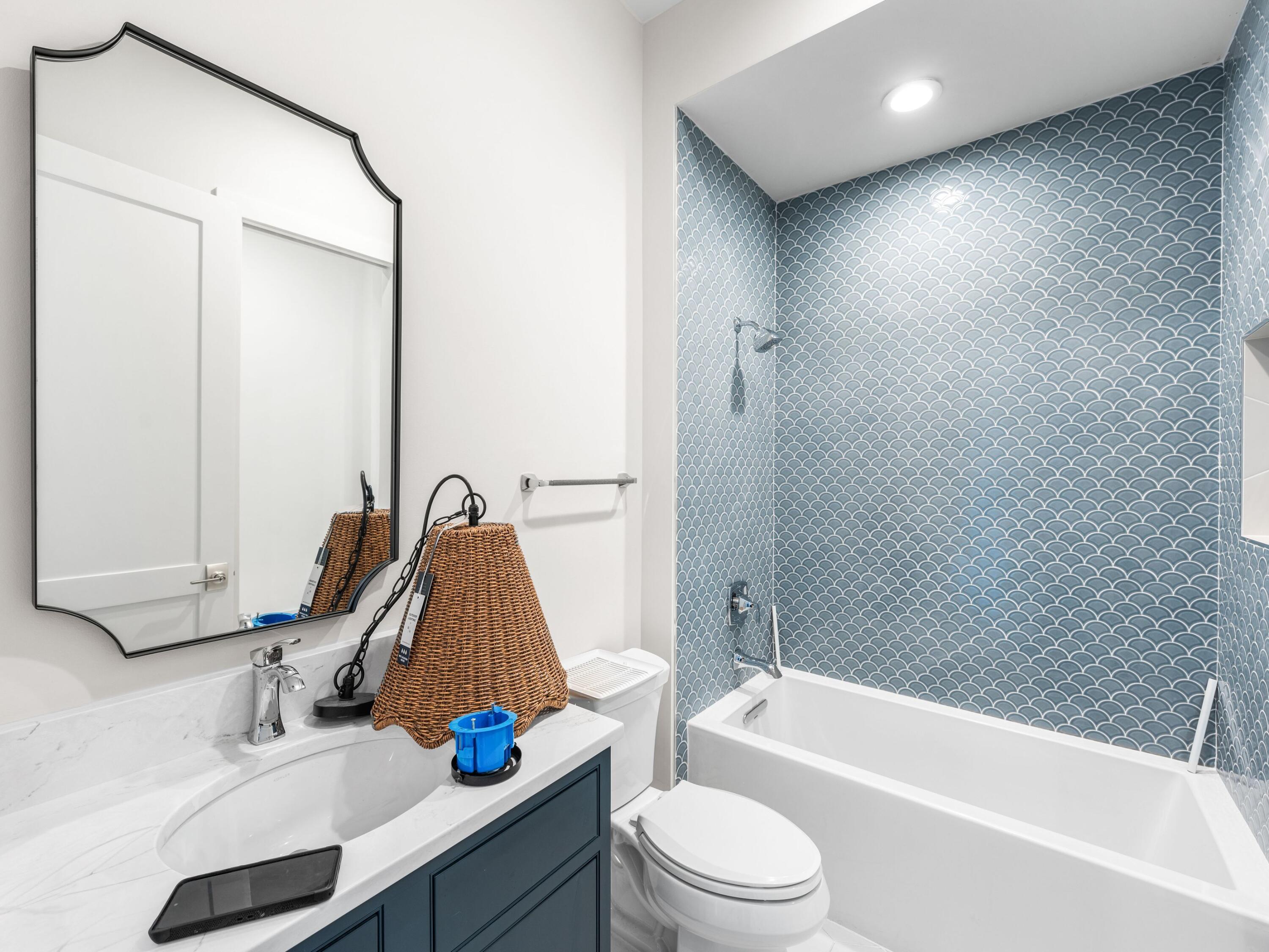 303 Golfridge Drive Watersound, FL 32461 - Photo 37 of 50 a bathroom with a sink toilet and shower