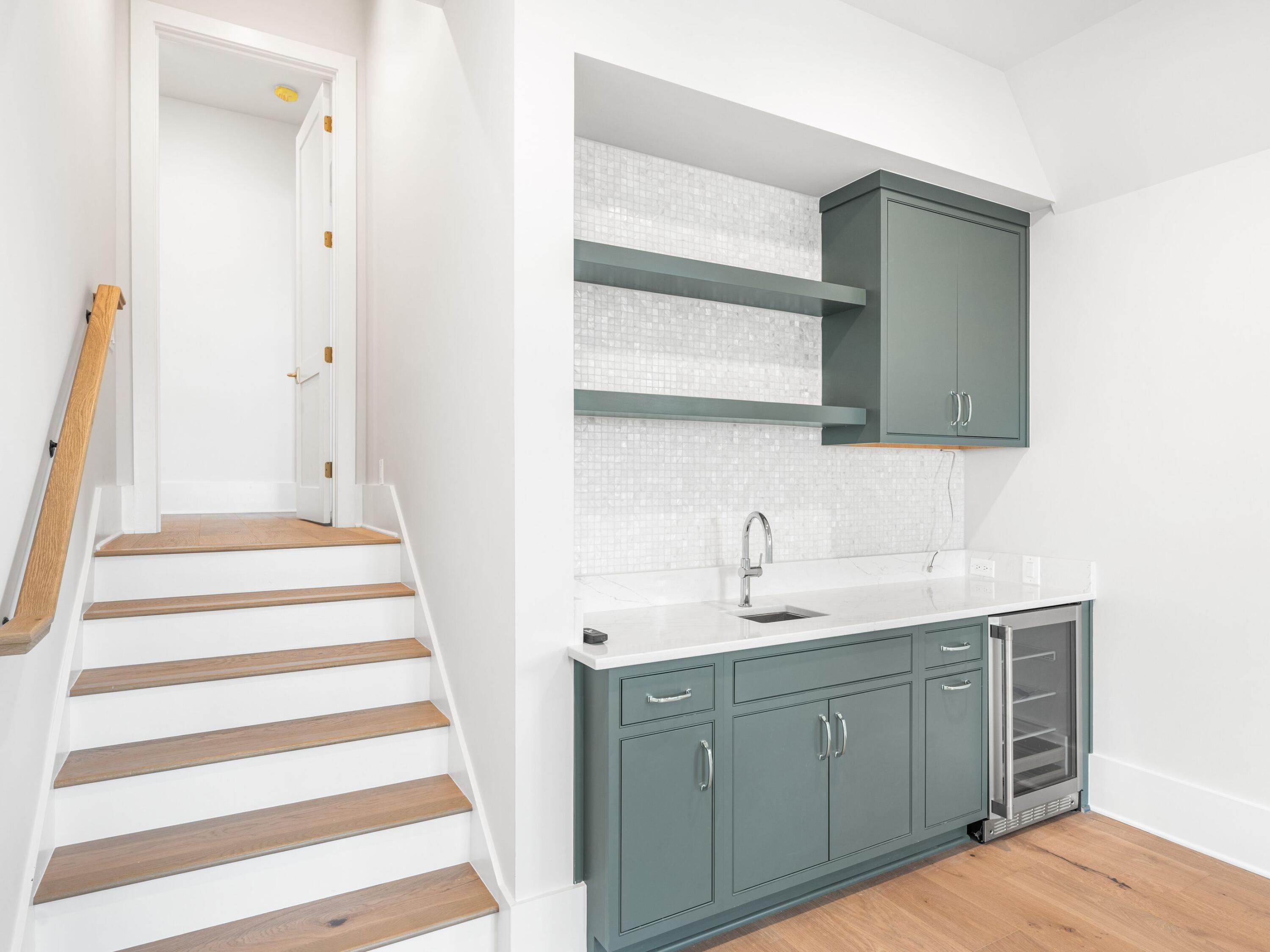 303 Golfridge Drive Watersound, FL 32461 - Photo 41 of 50 a bathroom with a sink and a mirror