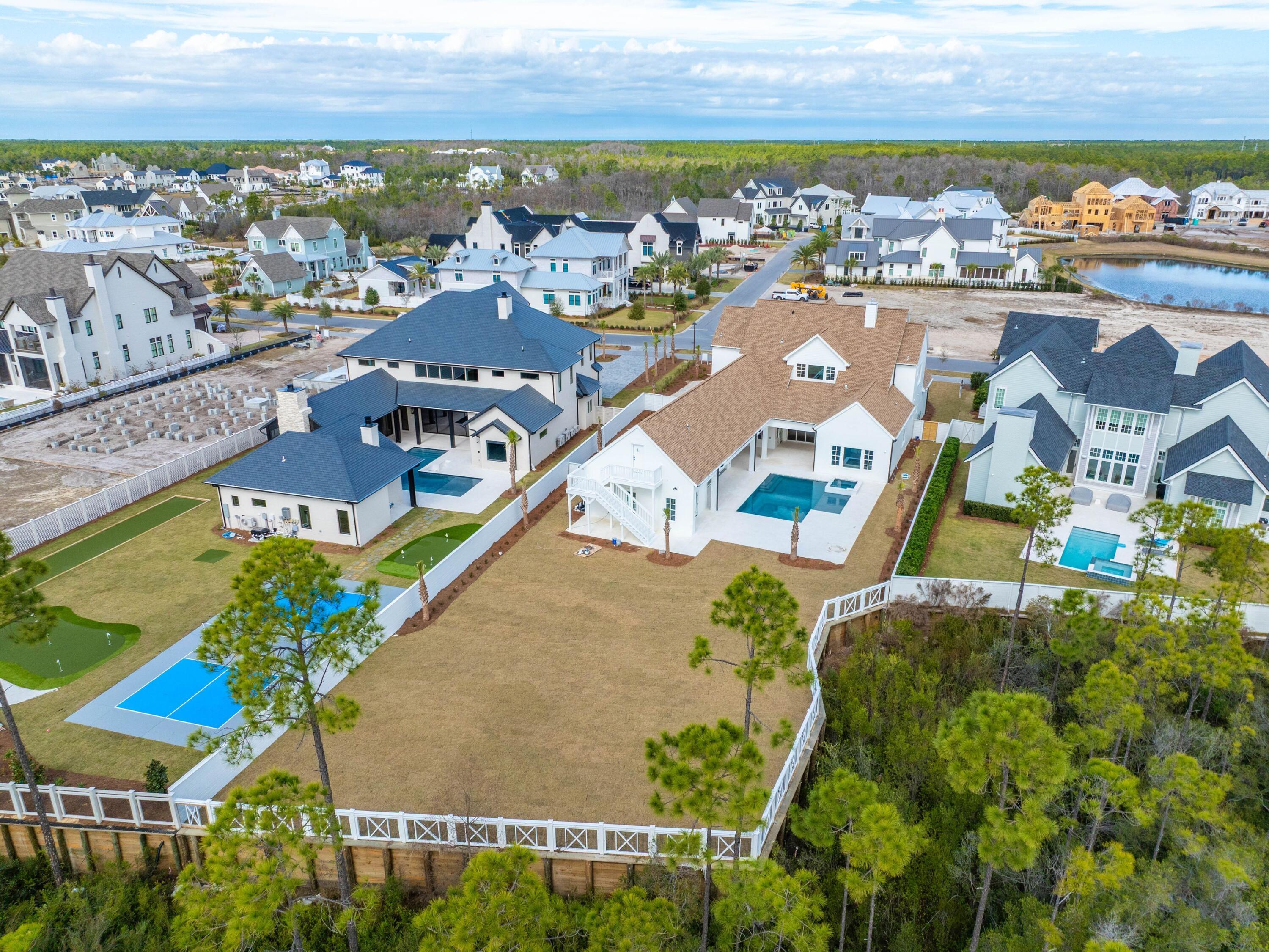303 Golfridge Drive Watersound, FL 32461 - Photo 47 of 50 an aerial view of residential houses with outdoor space