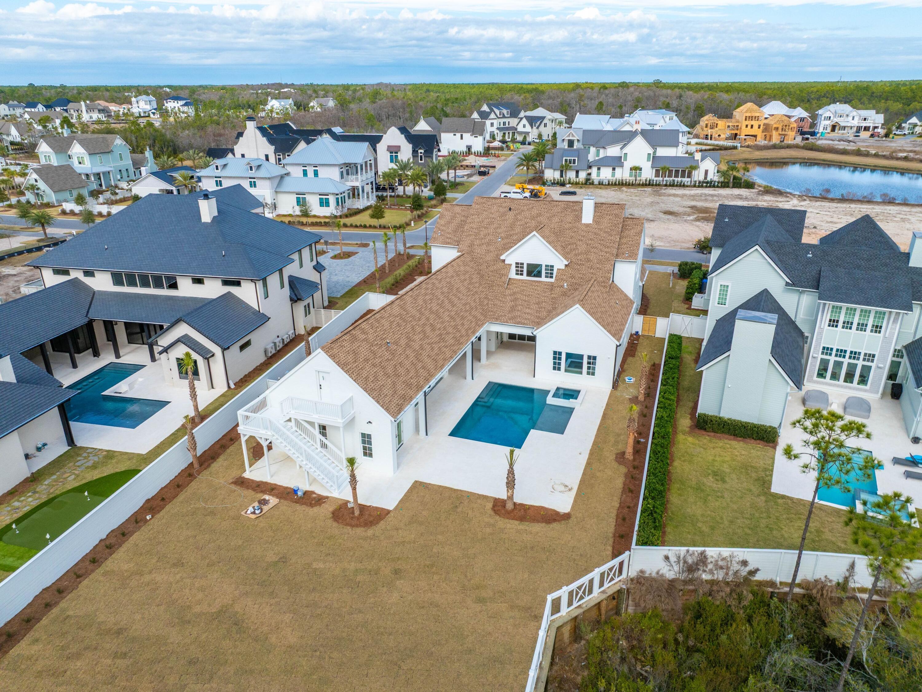 303 Golfridge Drive Watersound, FL 32461 - Photo 48 of 50 an aerial view of residential houses with outdoor space