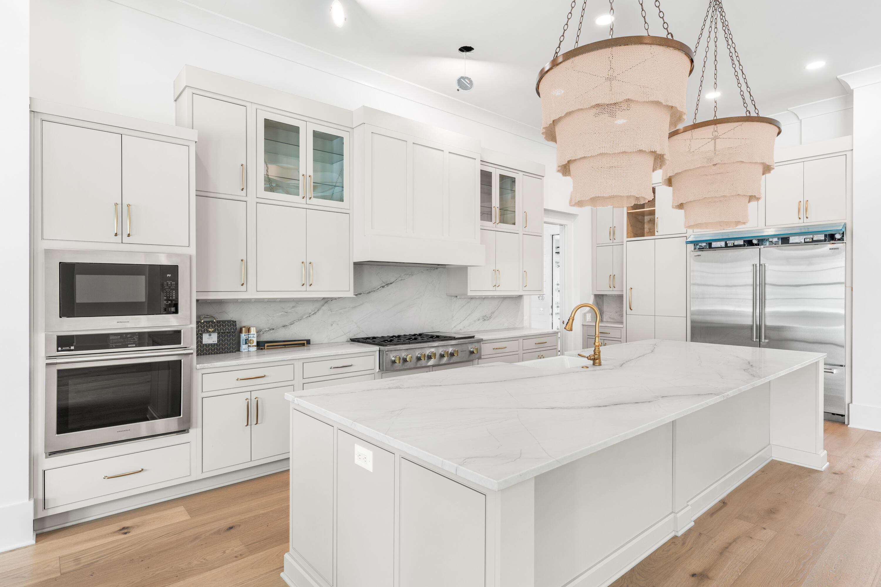 303 Golfridge Drive Watersound, FL 32461 - Photo 50 of 50 a kitchen with stainless steel appliances granite countertop a sink a stove and a microwave