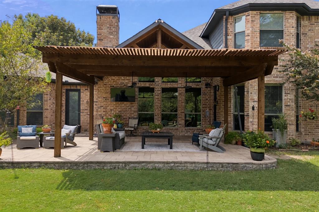1520 Snider Court Lucas, TX 75002 - Photo 34 of 40 Enjoy the peace and tranquility of the extended covered patio overlooking the oversized back yard and pasture.