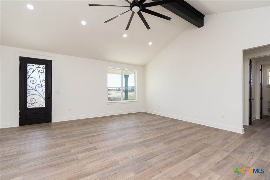 4245 Stringtown Road Temple, TX 76501 - Photo 5 of 25 wooden floor in an empty room with a window