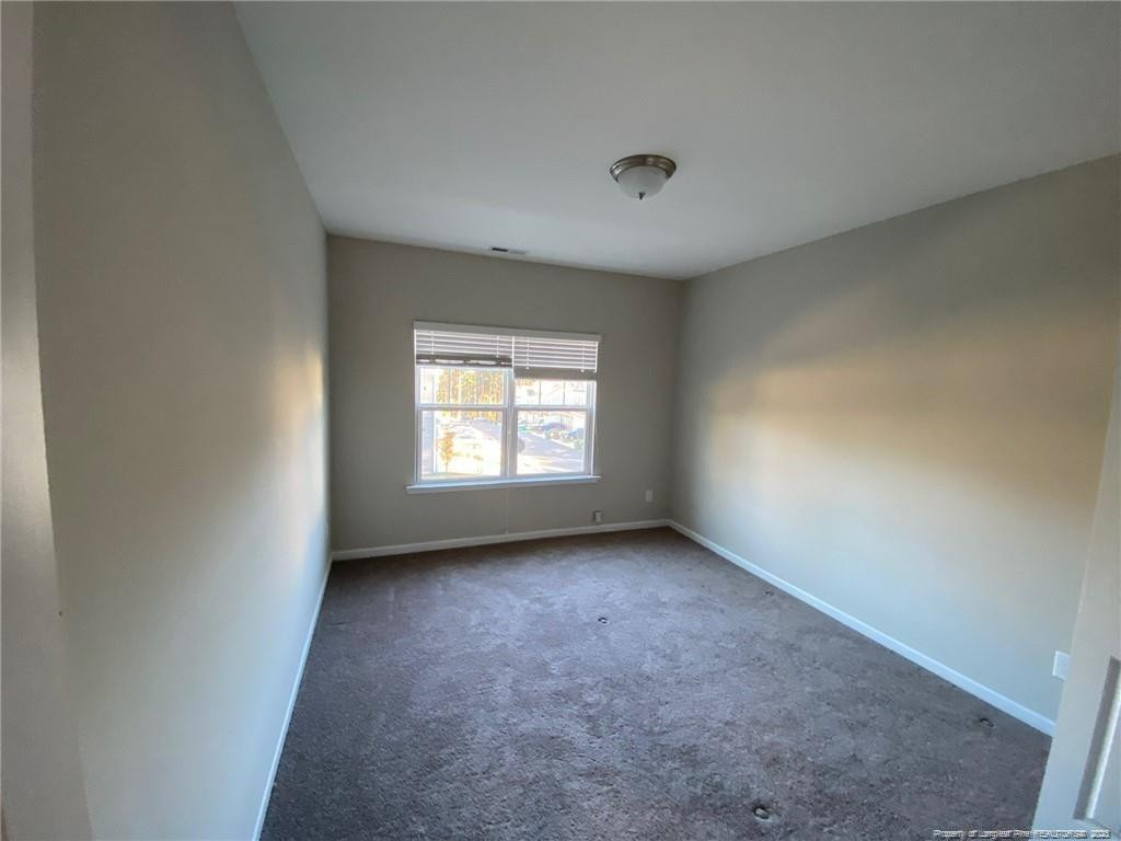1206 Wingstem Place Raleigh, NC 27607 - Photo 6 of 17 an empty room with a window
