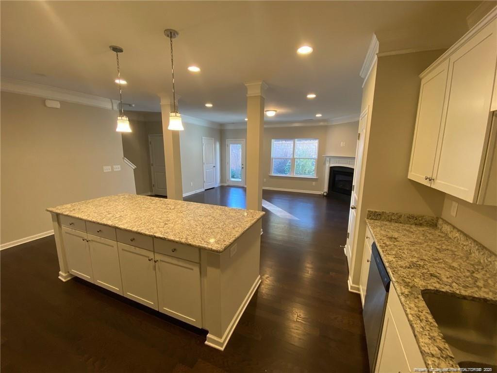 1206 Wingstem Place Raleigh, NC 27607 - Photo 8 of 17 a spacious bathroom with a granite countertop sink a large mirror and a shower