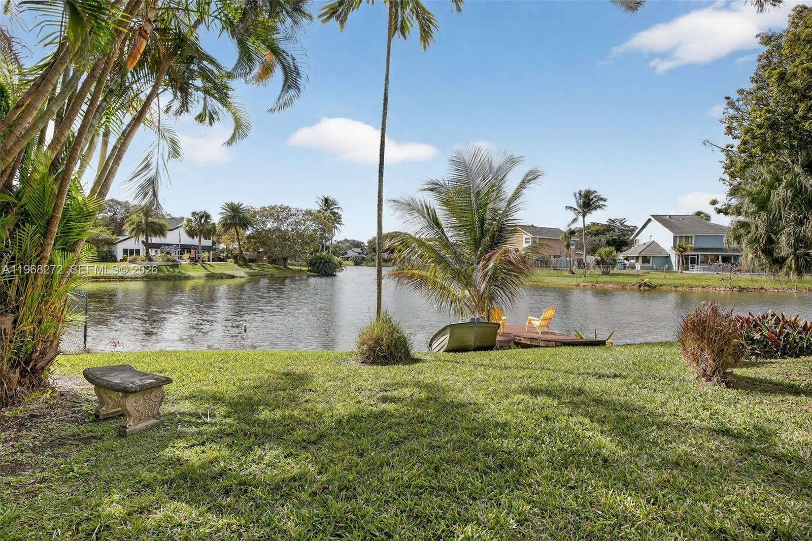 8740 Southwest 56th Place Cooper City, FL 33328 - Photo 22 of 54 a lake with palm trees
