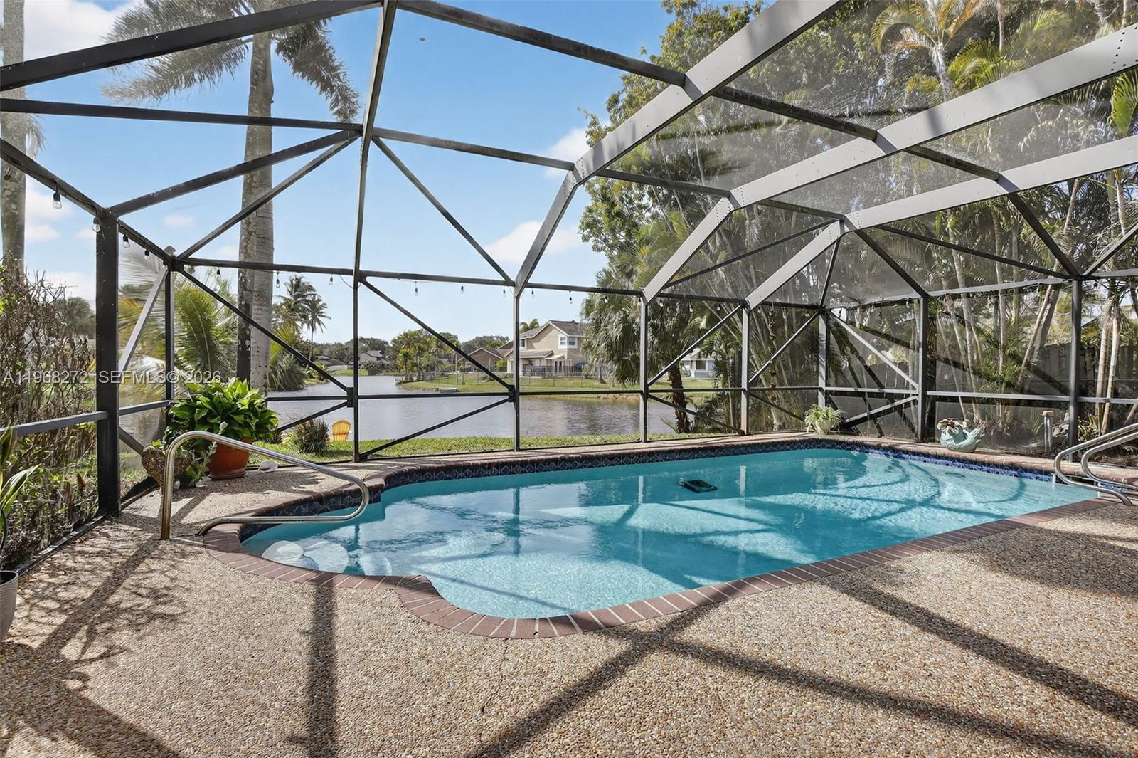 8740 Southwest 56th Place Cooper City, FL 33328 - Photo 3 of 54 a view of a house with a backyard