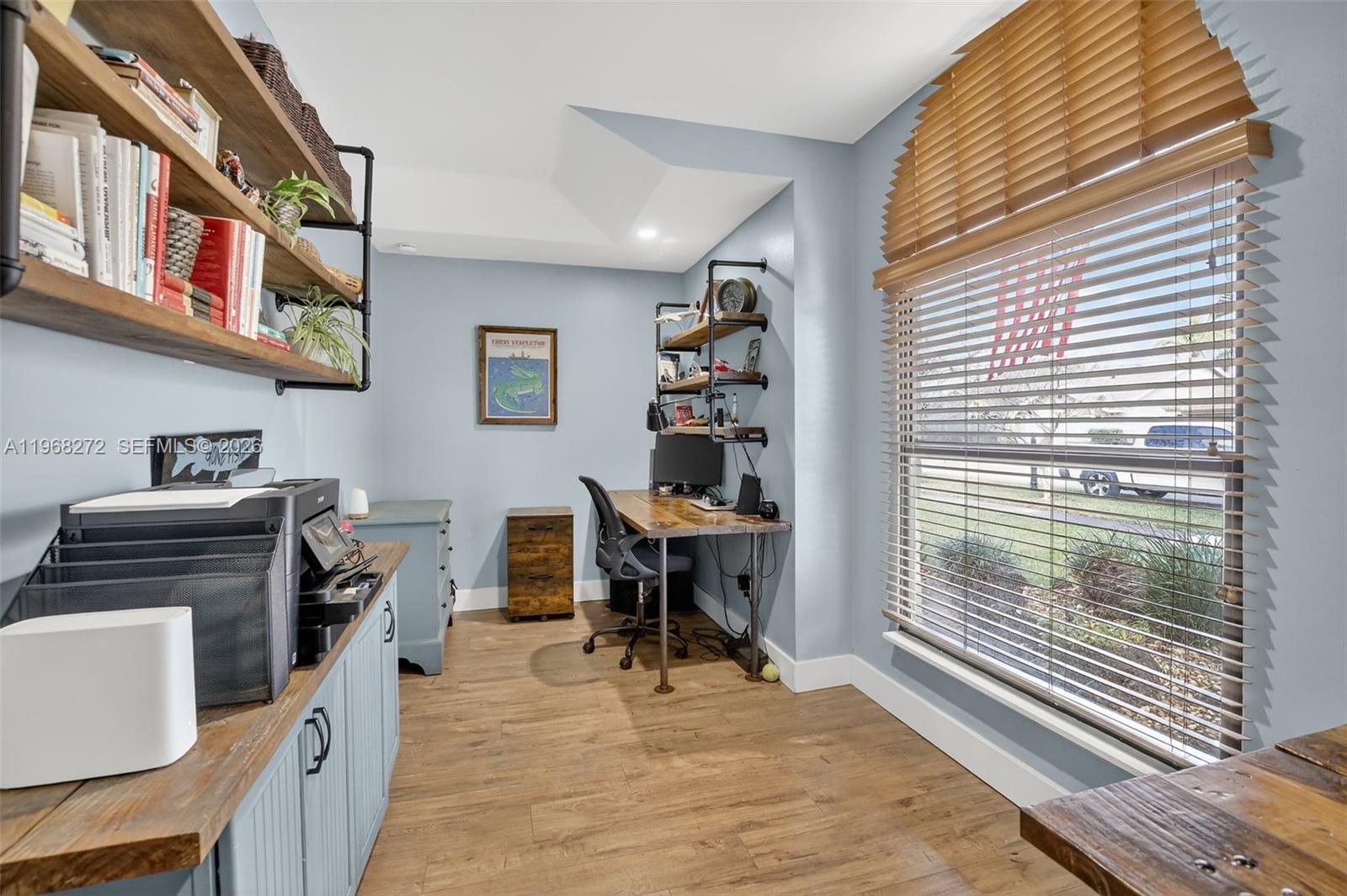 8740 Southwest 56th Place Cooper City, FL 33328 - Photo 31 of 54 a view of a workspace with furniture and a window