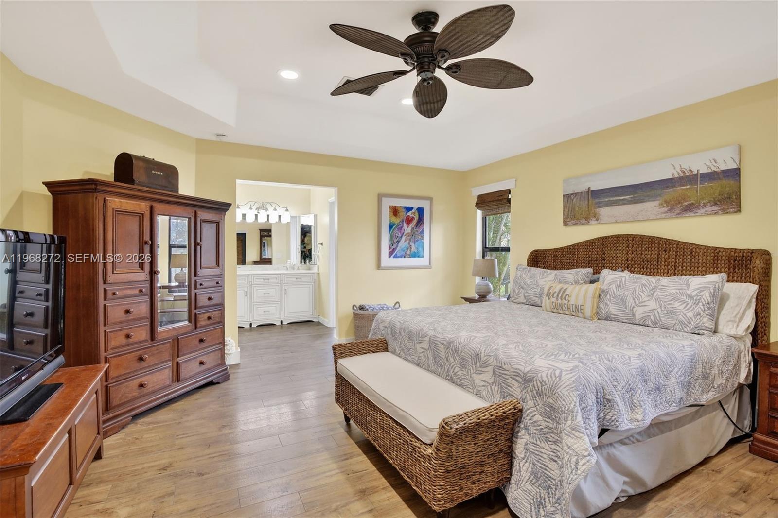 8740 Southwest 56th Place Cooper City, FL 33328 - Photo 34 of 54 a spacious bedroom with a bed and wooden floor