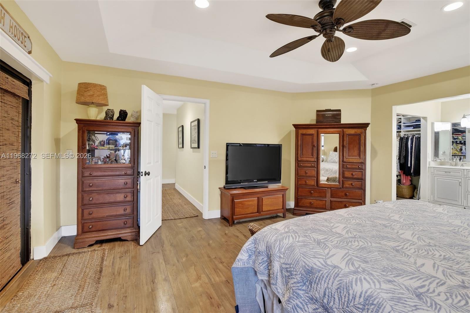 8740 Southwest 56th Place Cooper City, FL 33328 - Photo 35 of 54 a bedroom with a bed and a flat screen tv
