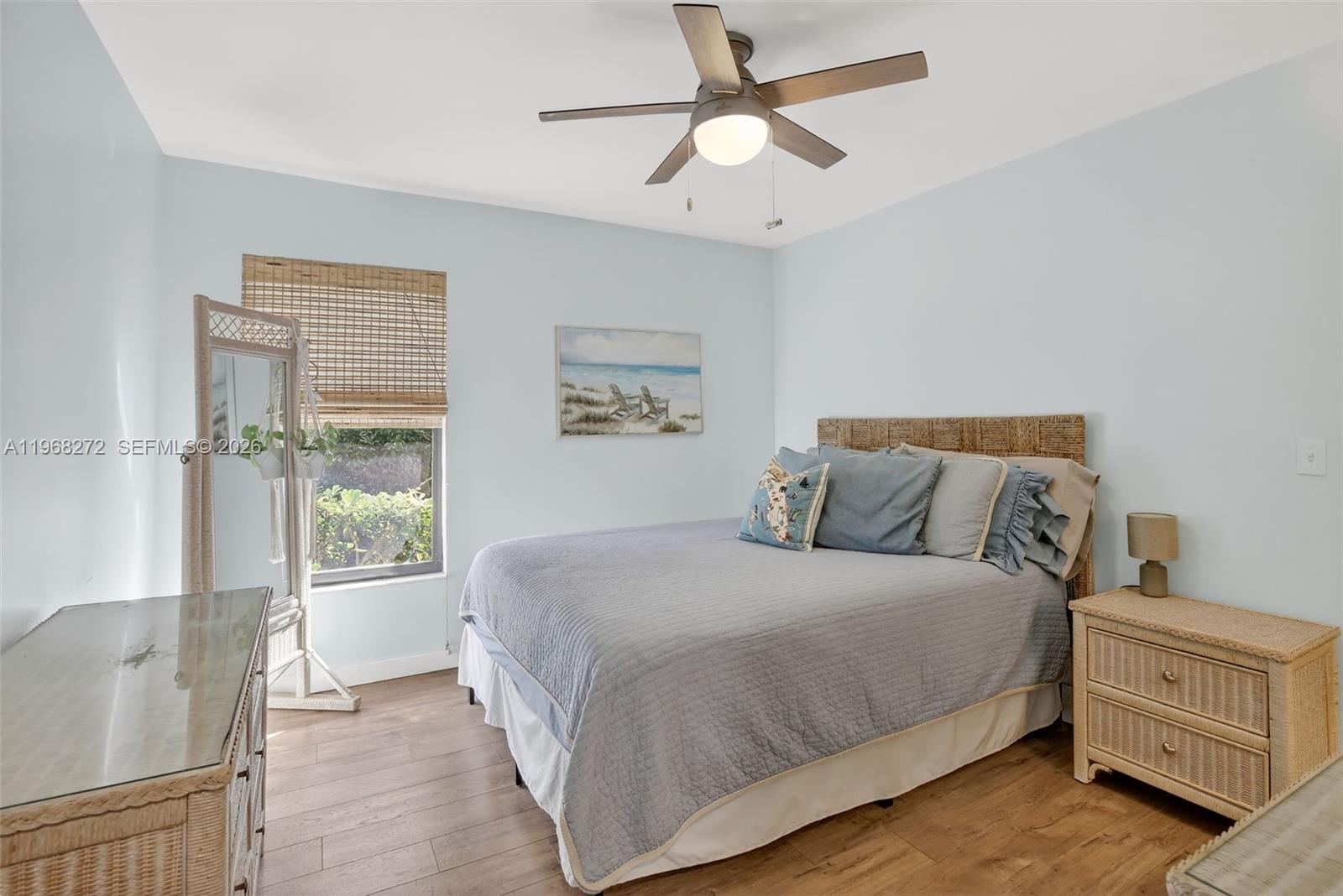 8740 Southwest 56th Place Cooper City, FL 33328 - Photo 40 of 54 a bedroom with a large bed and a window