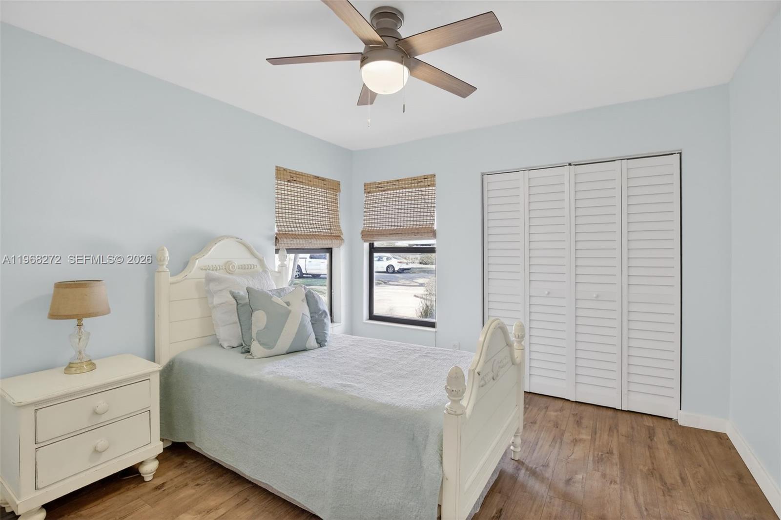 8740 Southwest 56th Place Cooper City, FL 33328 - Photo 42 of 54 a bedroom with a bed and a chandelier