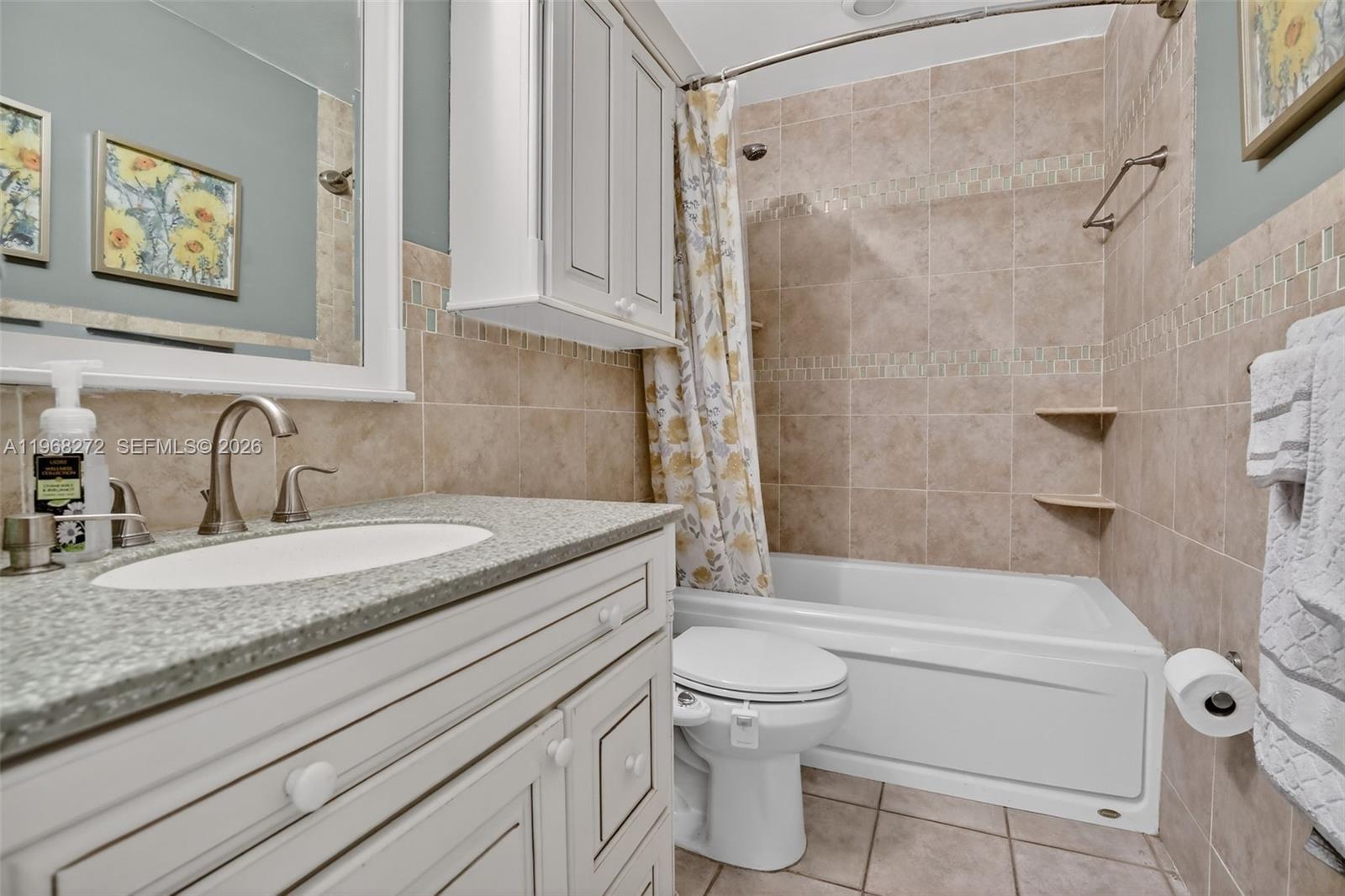 8740 Southwest 56th Place Cooper City, FL 33328 - Photo 44 of 54 a bathroom with a granite countertop sink toilet and shower