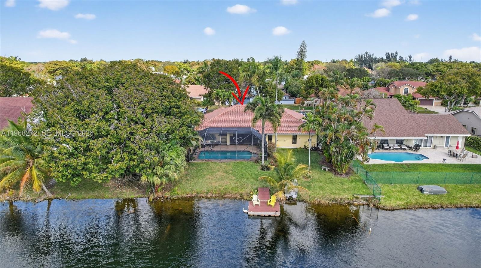 8740 Southwest 56th Place Cooper City, FL 33328 - Photo 54 of 54 an aerial view of a house with a yard and lake view