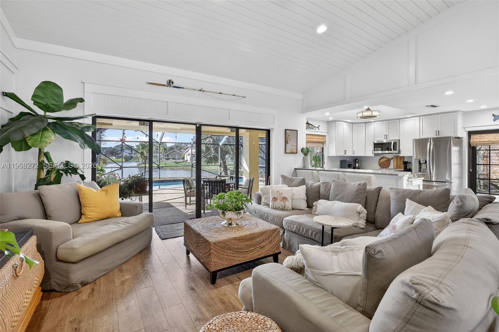 8740 Southwest 56th Place Cooper City, FL 33328 - Photo 6 of 54 a living room with furniture and a large window