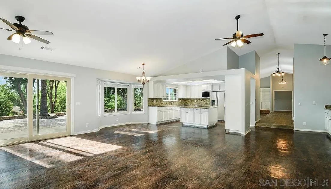 14525 Millards Ranch Lane Poway, CA 92064 - Photo 11 of 29 a view of empty room with wooden floor and fan
