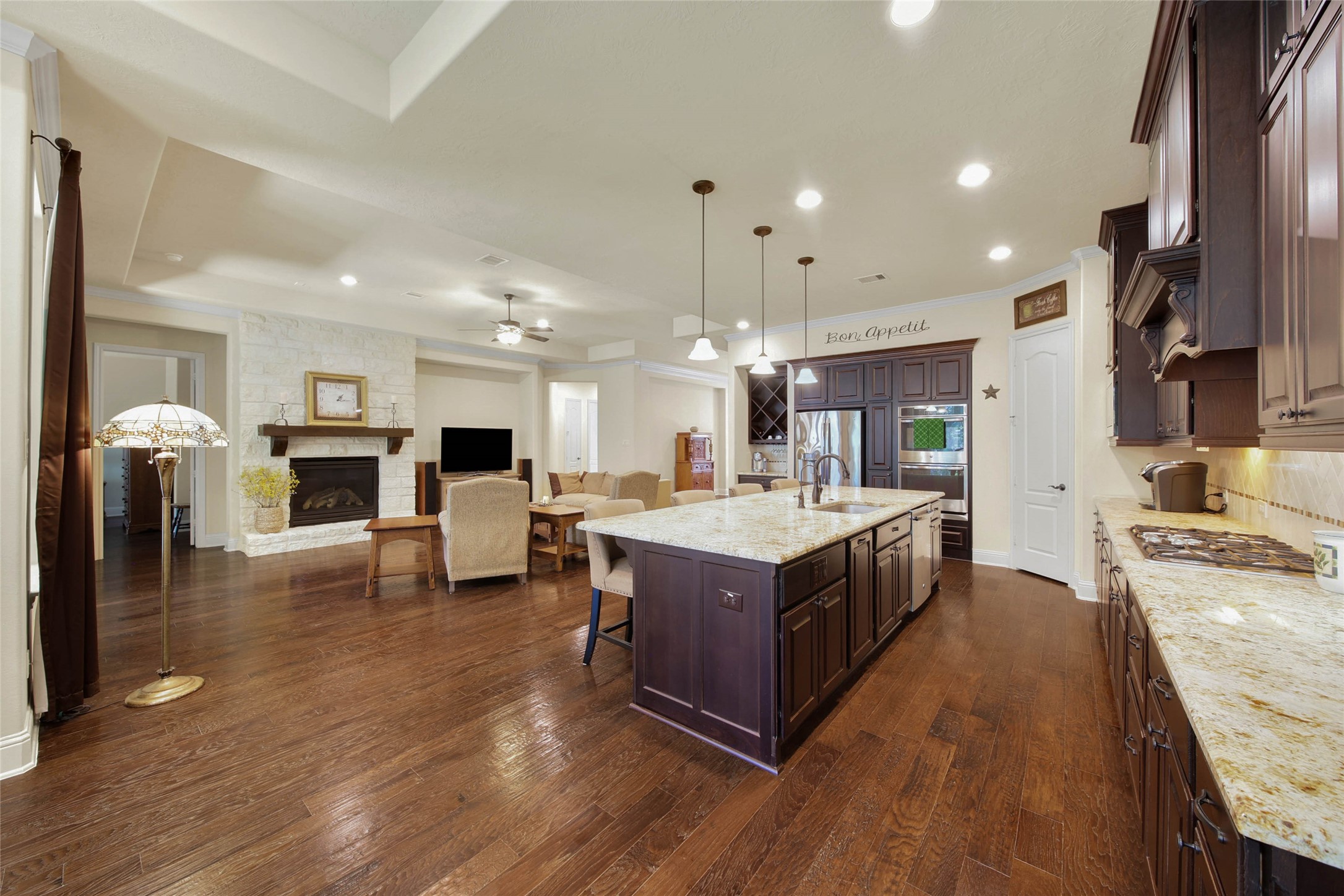 3234 Explorer Way Conroe, TX 77301 - Photo 22 of 46 An oversized island anchors the kitchen while maintaining views across the main living areas.