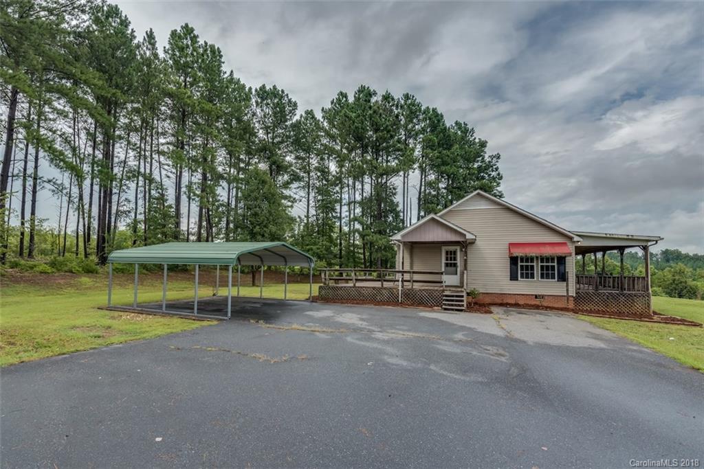 971 Matthew Church Road Rutherfordton, NC 28139 - Photo 22 of 24 a view of a house with a yard and sitting area