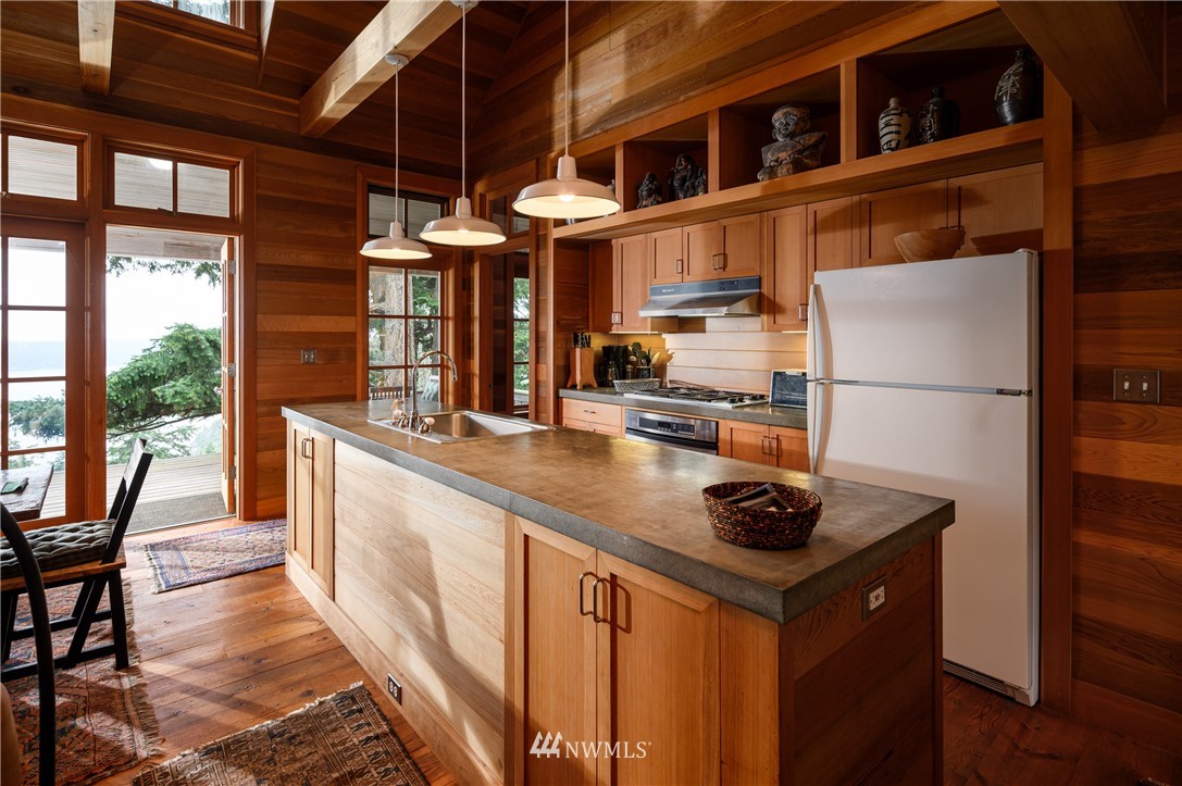 4-dh 4-dh 4-dh Decatur Street Northwest Anacortes, WA 98221 - Photo 11 of 24 a kitchen with stainless steel appliances granite countertop a sink and a refrigerator