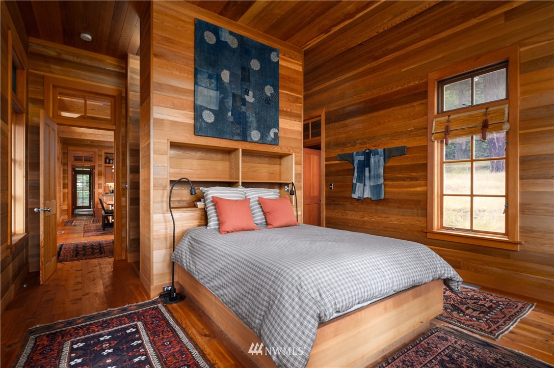 4-dh 4-dh 4-dh Decatur Street Northwest Anacortes, WA 98221 - Photo 12 of 24 a bedroom with a bed next to a window