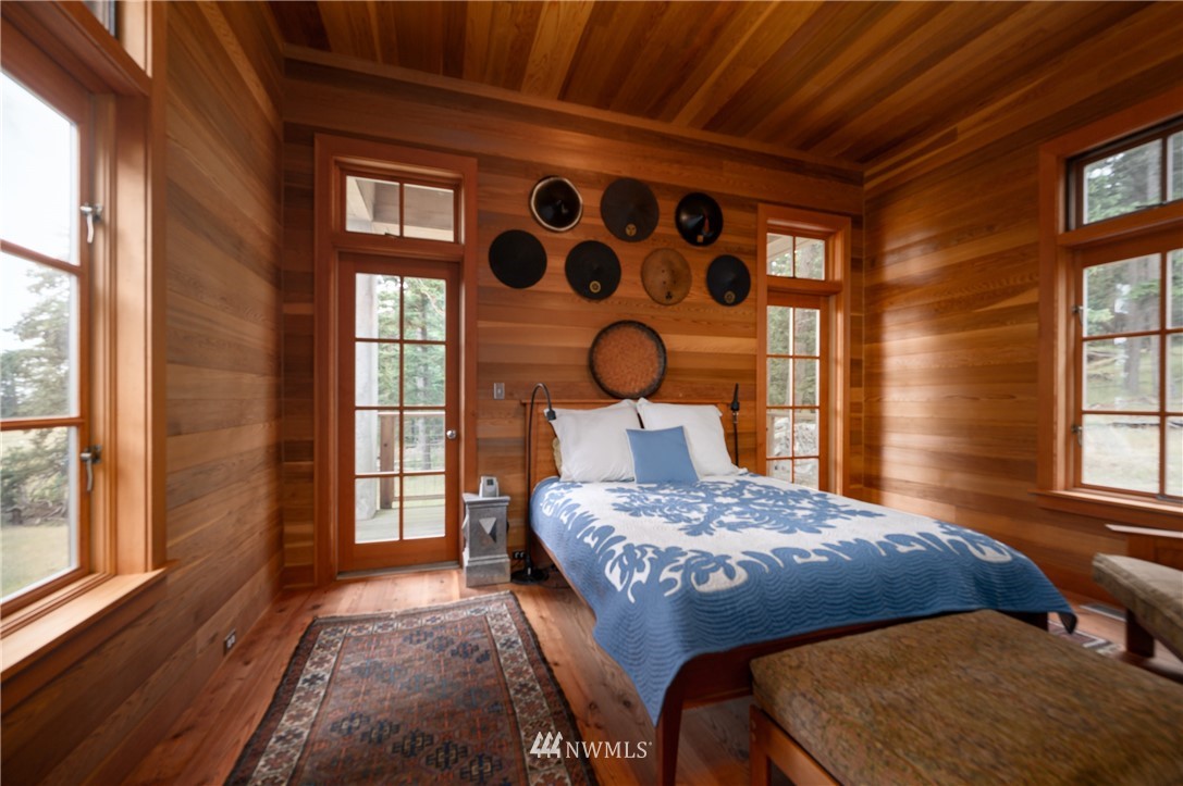 4-dh 4-dh 4-dh Decatur Street Northwest Anacortes, WA 98221 - Photo 15 of 24 a bedroom with a bed and wooden floor