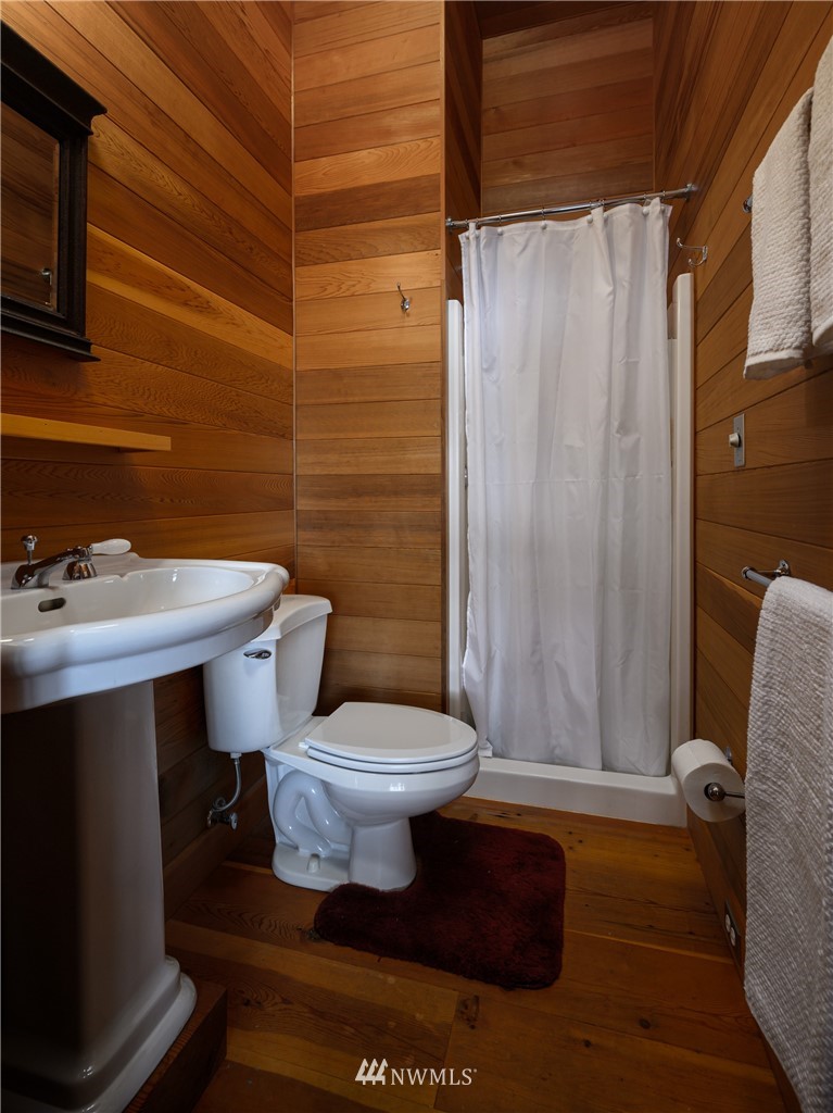 4-dh 4-dh 4-dh Decatur Street Northwest Anacortes, WA 98221 - Photo 16 of 24 a bathroom with a sink toilet and shower