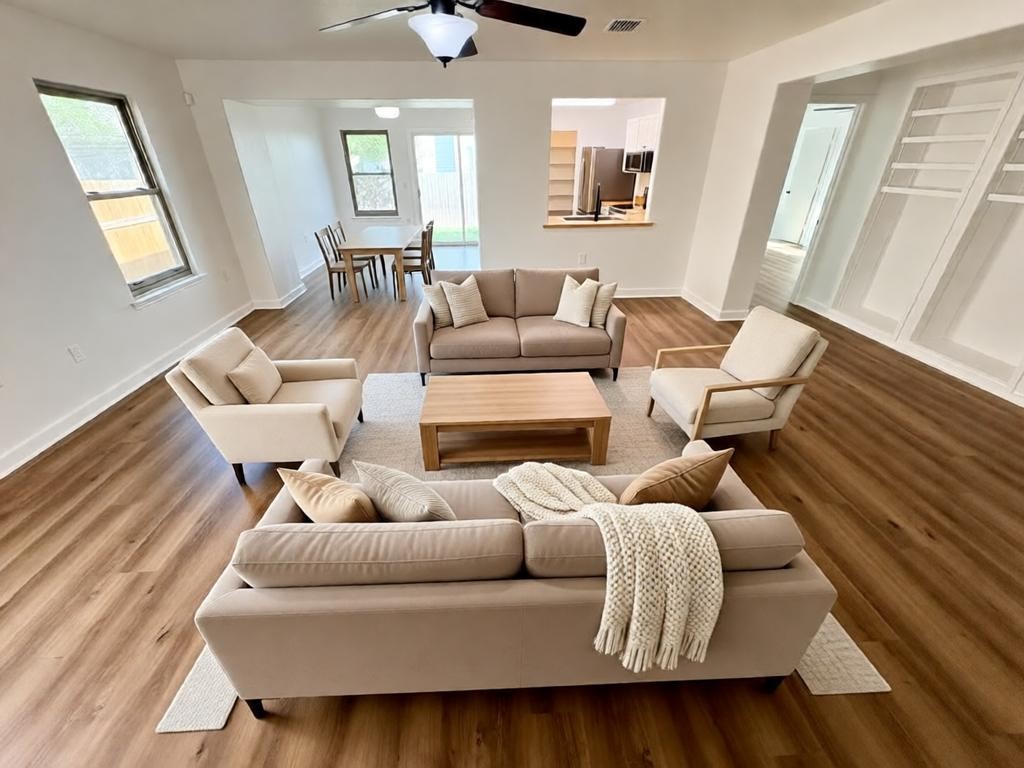 8003 Bannock Lane Austin, TX 78747 - Photo 4 of 40 The property features wood-style flooring throughout, with white walls and baseboards