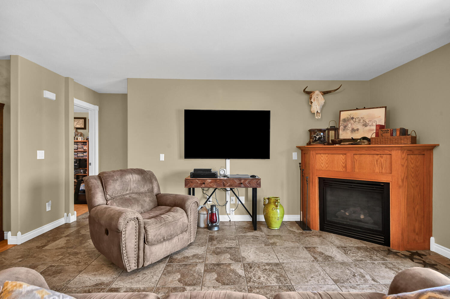 9345 Southwest Old West Road Powell Butte, OR 97753 - Photo 18 of 48 18_living room to fireplace