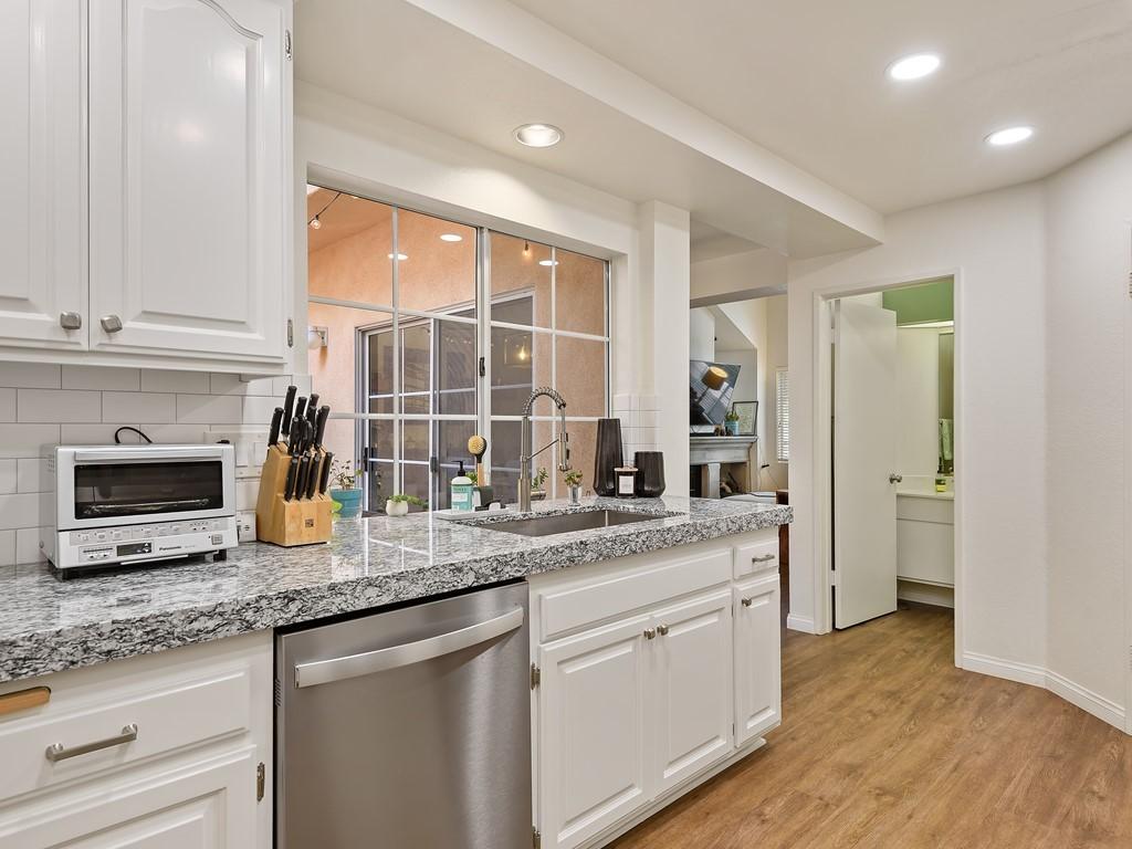 333 Pacific Oaks Road Goleta, CA 93117 - Photo 10 of 26 Kitchen toward Powder Room & Dining Area