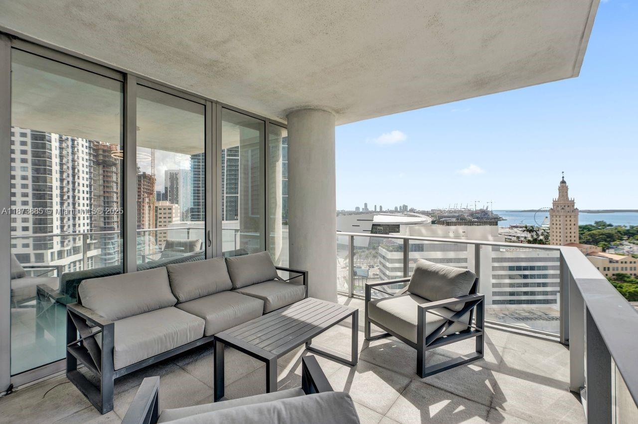 851 Northeast 1st Avenue, Unit 1411 Miami, FL 33132 - Photo 19 of 58 a living room with furniture and a floor to ceiling window