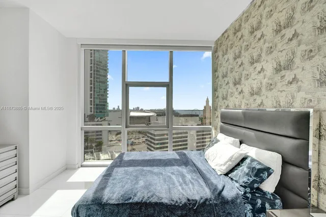 a bedroom with a bed and walk in closet