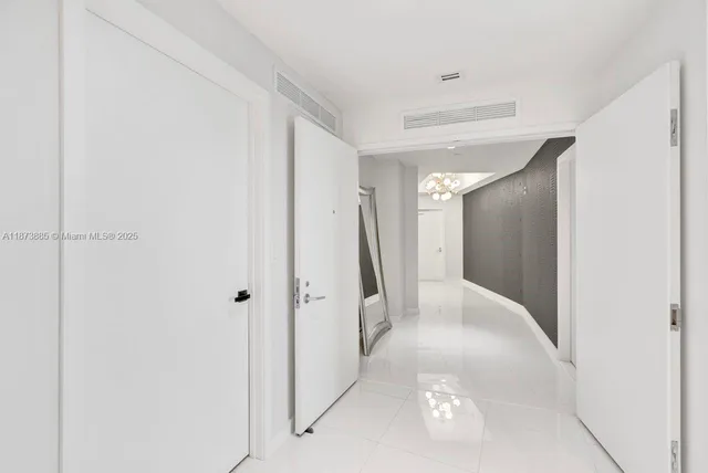 a swimming pool with outdoor seating and a garden