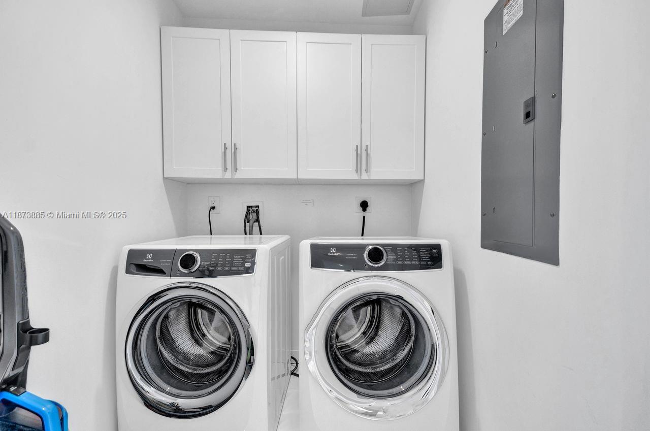 851 Northeast 1st Avenue, Unit 1411 Miami, FL 33132 - Photo 39 of 58 a utility room with dryer and washer