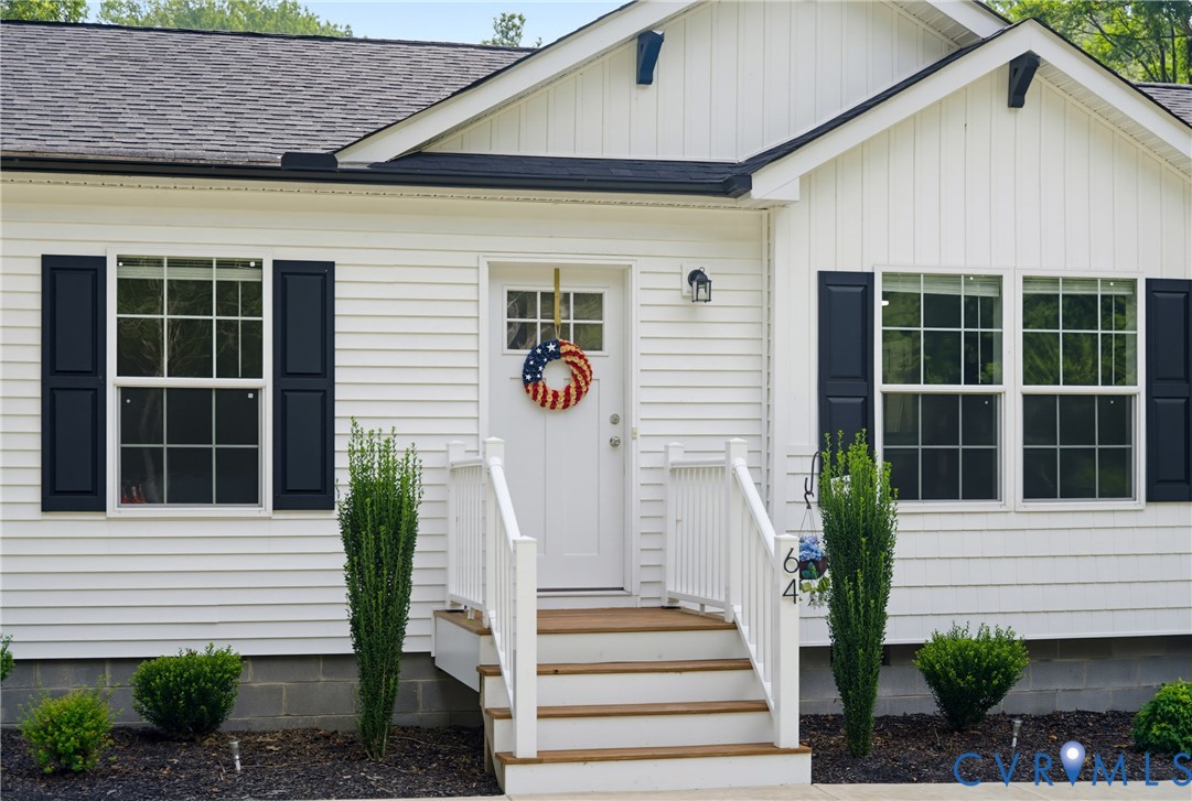 64 Pine Road Louisa, VA 23093 - Photo 4 of 53 White siding exterior featuring black shutters and