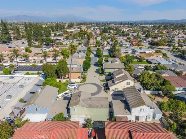an aerial view of residential houses with outdoor space
