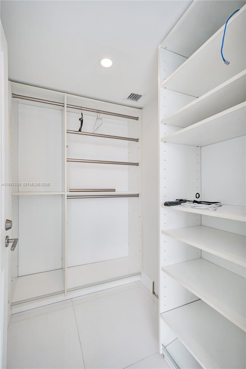 495 Brickell Avenue, Unit 2301 Miami, FL 33131 - Photo 31 of 61 a view of an empty walk in closet