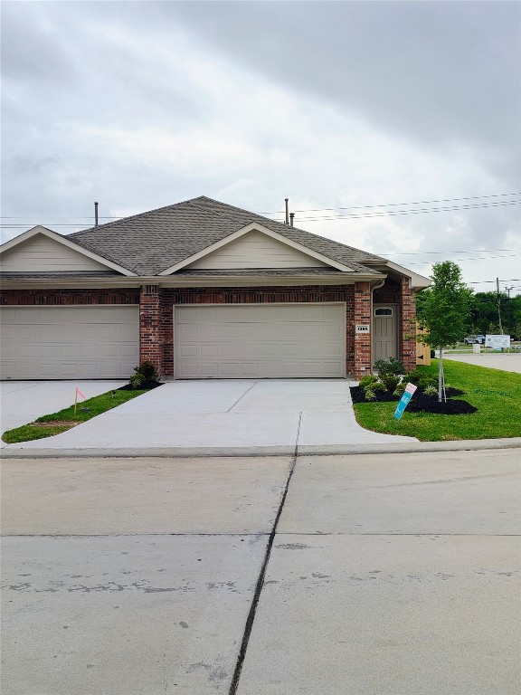 a front view of a house with a garden and plants