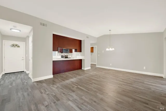 a view of kitchen with wooden floor