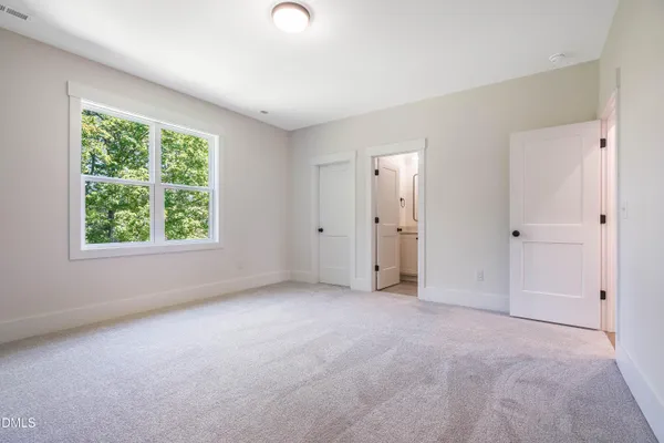 a view of an empty room with windows