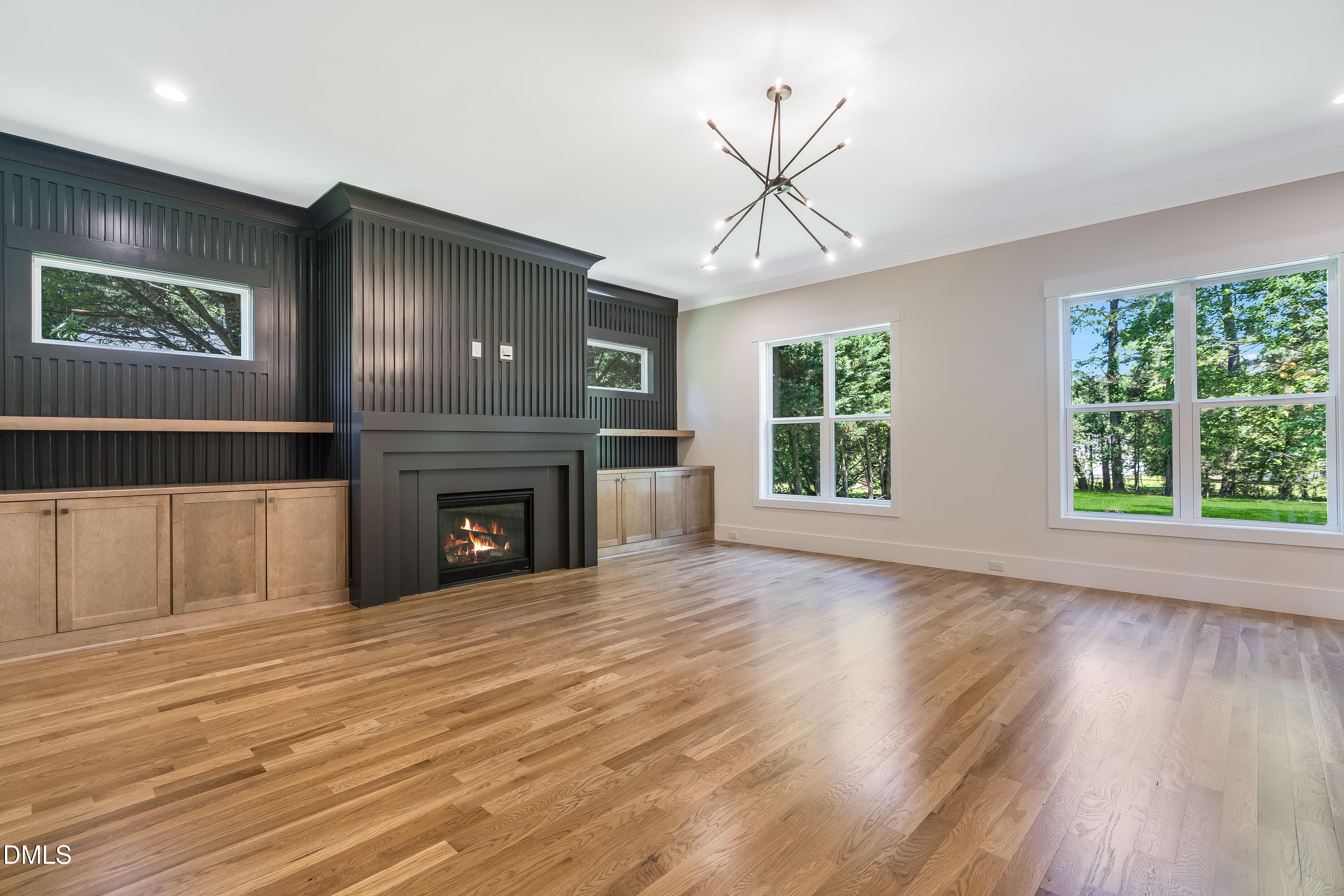 14020 Durant Road Raleigh, NC 27614 - Photo 27 of 86 a view of an empty room with wooden floor fireplace and a window